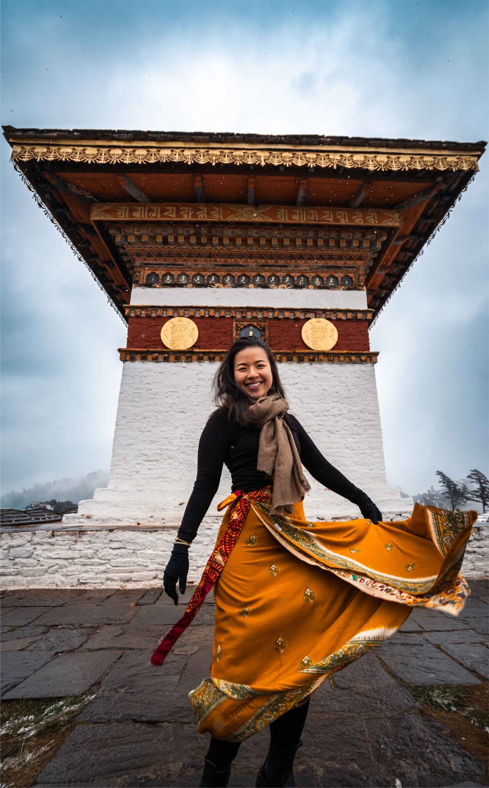 Portrait of a beautiful woman standing at the scenic Dochula Pass in Bhutan